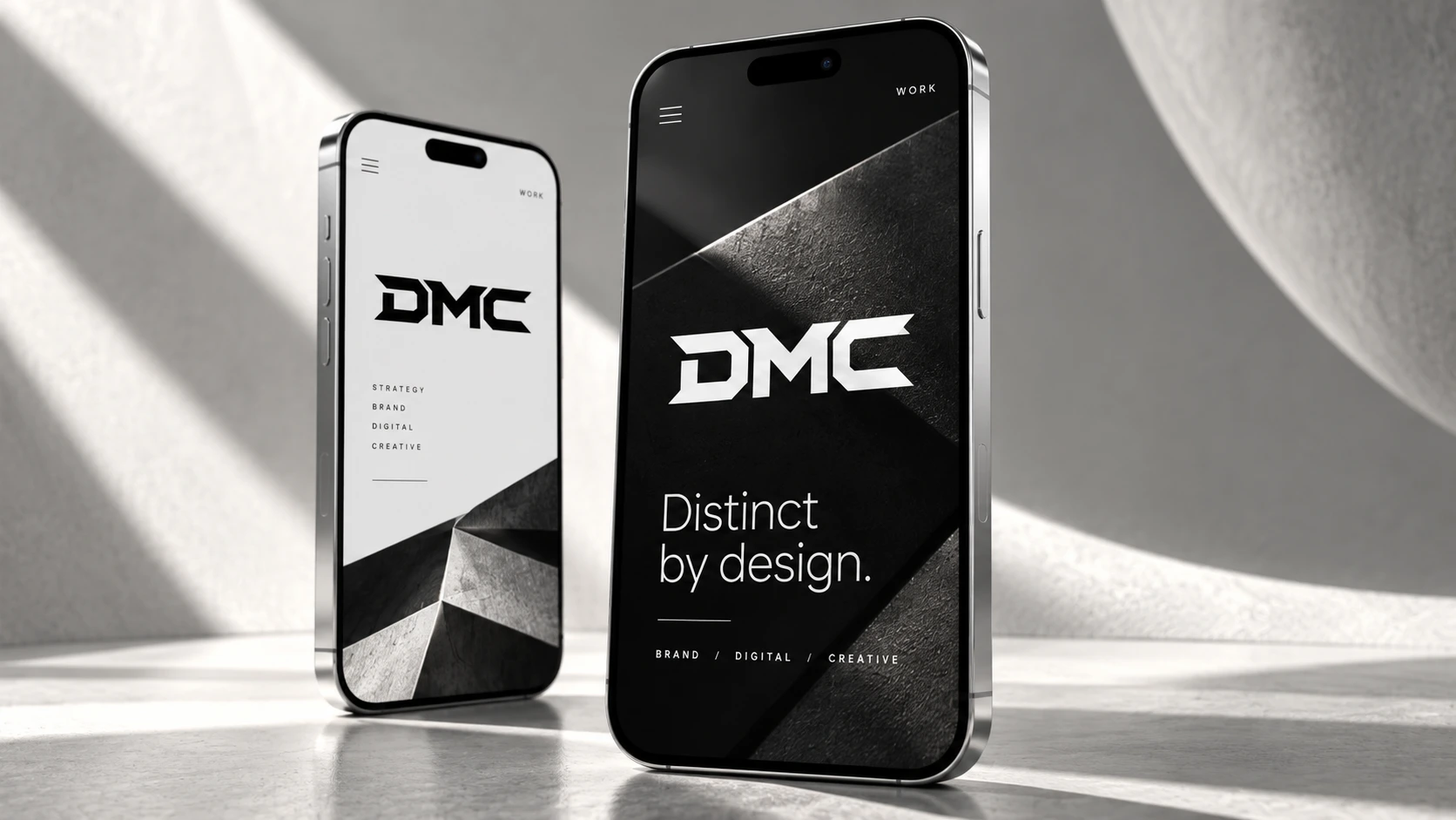 DMC mobile website concepts on paired silver smartphones